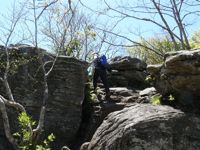 Keith climbing rocks